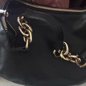 Elegant Black Leather Handbag with Gold Accents